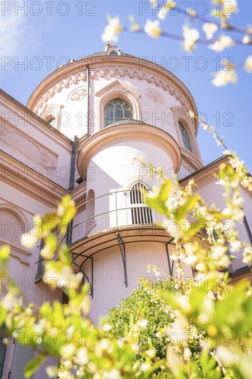 Close-up of a historic dome surrounded by blossoming flowers in spring, Mosque, Schwetzingen Palace