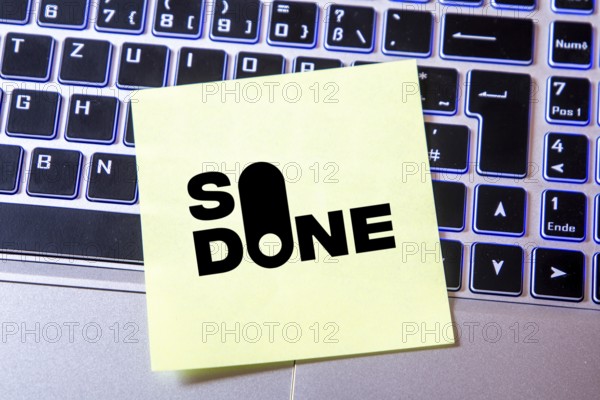 Notepad with the SO DONE logo on a laptop (composing) . SO DONE is a reporting portal specialising