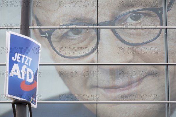 An election poster of the far-right AfD party (now AfD) hangs in front of a portrait of Friedrich