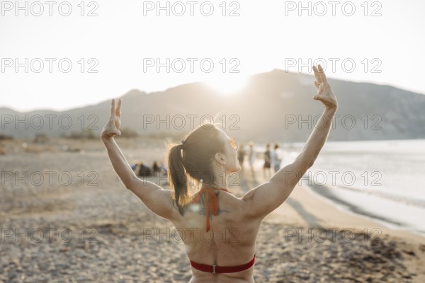 Woman relaxing in a bikini on the beach, Greece