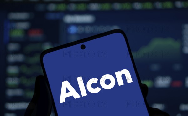 Alcon logo is displayed on smartphone. Alcon Inc. is a Swiss-American pharmaceutical and medical