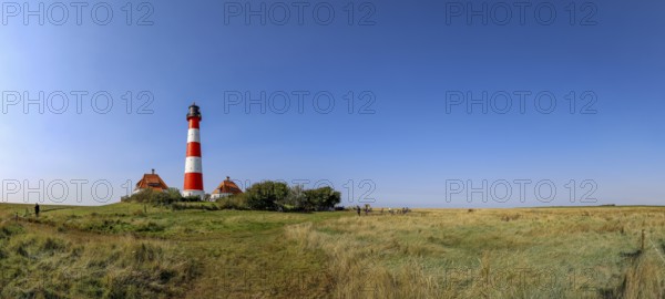 Panoramic photo 40 metre high Westerheversand lighthouse built in 1906 on the Eiderstedt peninsula