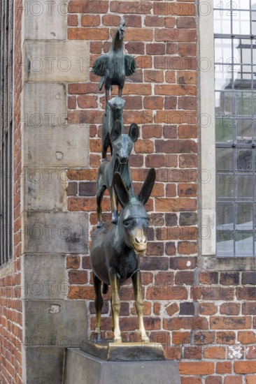 The famous bronze statue of the Bremen Town Musicians with the figures of a donkey, dog, cat and