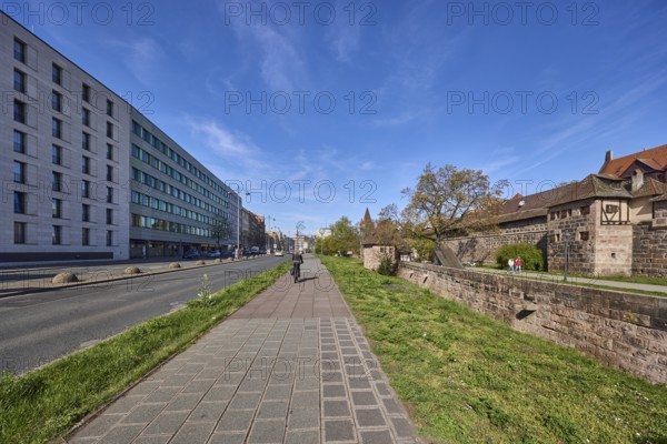 Footpath and cycle path, trees, meadow, city fortification, city wall, pedestrians and cyclists as