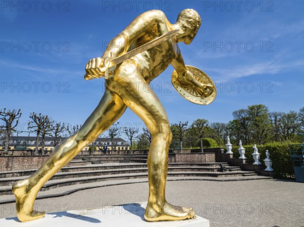 Golden sculpture, warrior with shield and sword, Herrenhausen Gardens, Baroque garden at castle