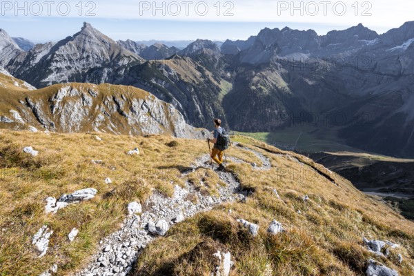 Mountain panorama with picturesque mountain landscape, mountaineers descending from the Gamsjoch,