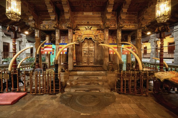 Temple of the sacred Tooth Relic or Sri Dalada Maligawa, Holy Shrine decorated with elephant tusks,
