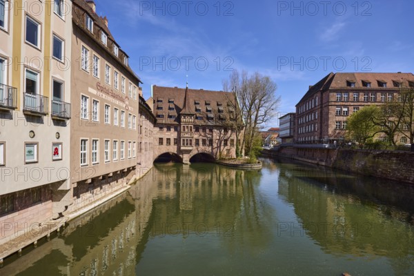 Heilig-Geist-Spital, historical building, river Pegnitz, facade, windows, trees, symmetrical