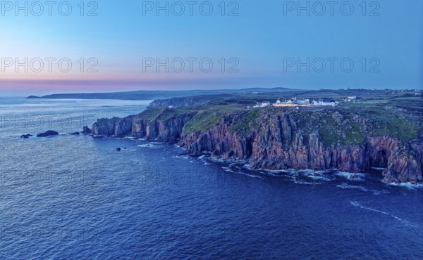 Land's End, landscape and hotel on the Atlantic, at dusk. Land's End, the tip of the headland in