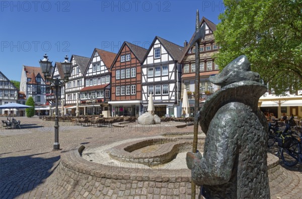 The statue of the night watchman on the market square in the historic old town of Rinteln. Lower