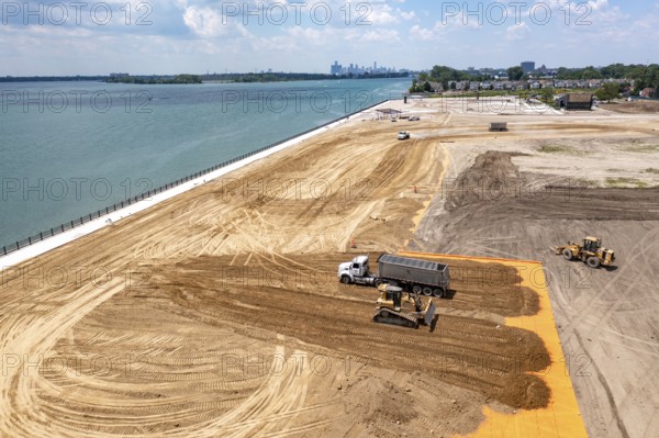 Detroit, Michigan - Workers spread clean dirt after old industrial contamination of cadmium,