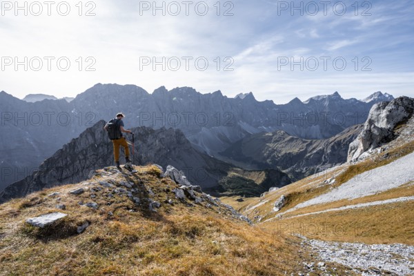 Mountain panorama with picturesque mountain landscape, mountaineers descending from the Gamsjoch,