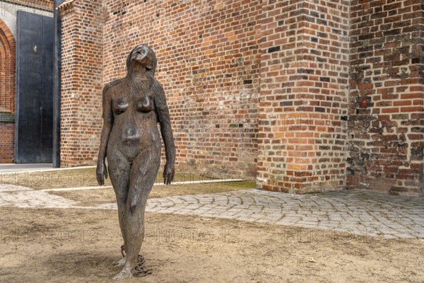 Sculpture of Mary Magdalene in the prison courtyard of the castle monastery, Hanseatic city of