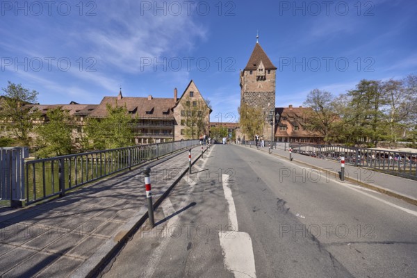 Schuldturm, historical buildings, car and pedestrian bridges, metal railings, blue sky,
