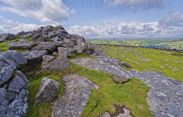 Stones and landscape at the top Tor tor rock hill in Dartmoor National Park. Widecombe-in-the-Moor,