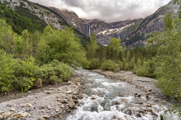 The Gave de Gavarnie river in the Cirque de Gavarnie basin, UNESCO World Heritage Site in the