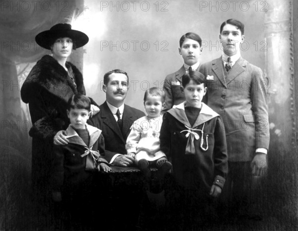 Family with 5 children, portrait of a family in traditional dress, formal group photo, historical