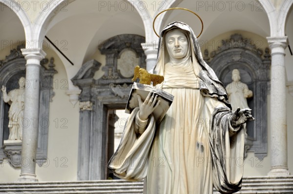 Marble statue of St Scholastica of Nursia by sculptor P. Campi of Carrara, Bramante Cloister,