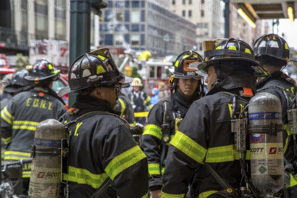 New York, United States of America, November 20, 2016: Group of firemen waiting in front of the