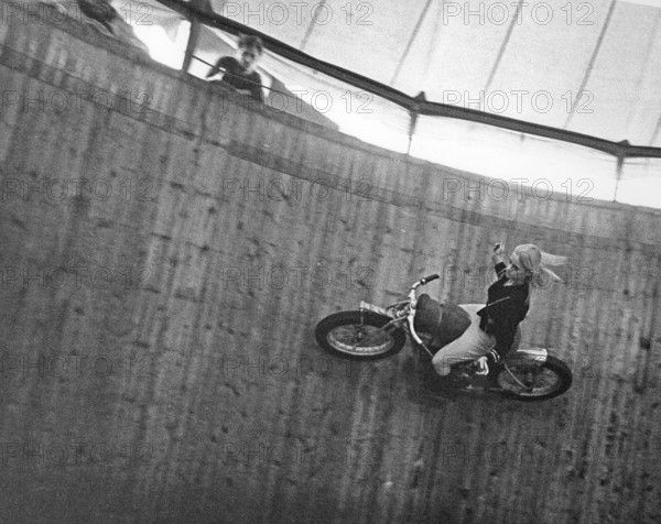 Wall of death 1967. The wall of death, motordrome, velodrome or well of death is a carnival