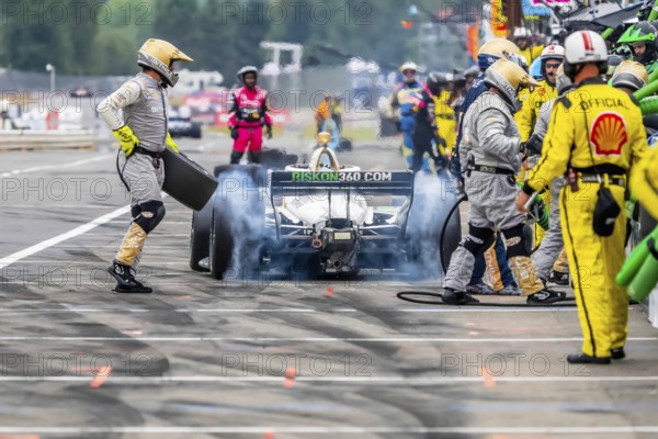 INDYCAR Series driver, RINUS VEEKAY (21) of Hoofddorp, Netherlands, brings his car in for service