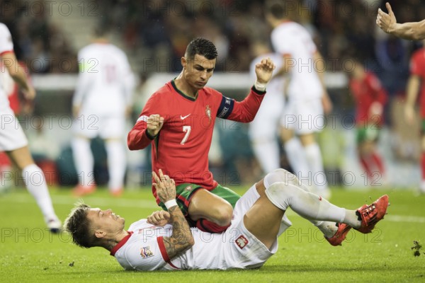 Football match, captain Cristiano RONALDO CR7 Portugal kneeling on the stomach and partly on the