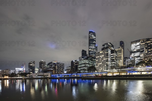 MELBOURNE, AUSTRALIA - JULY 5, 2024: Melbourne skyline as seen at dusk from Queens Bridge near