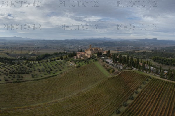 Montalcino, Italy, 16 November, 2023: aerial view of the Poggio alle Mura Castle and Villa Banfi
