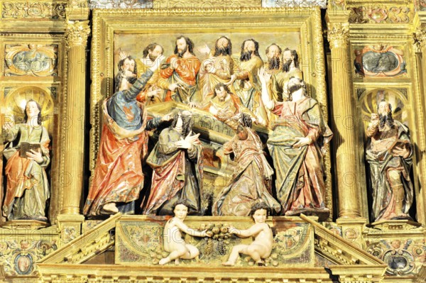 Detail of a baroque relief with religious figures and golden decorations, Iglesia de Santa Maria de