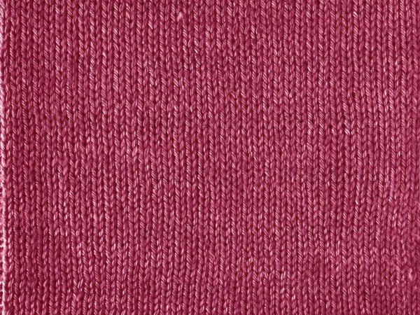 Viva Magenta color knitted Jersey as textile background. Knitted Red Magenta texture. Color of the