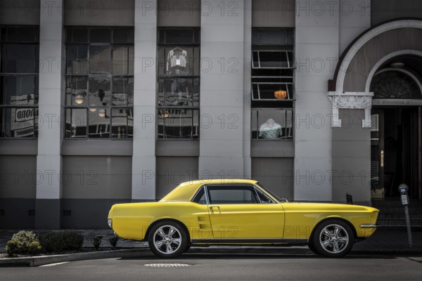 Vintage car parking in front of an Art Deco building in downtown Napier, North Island of New