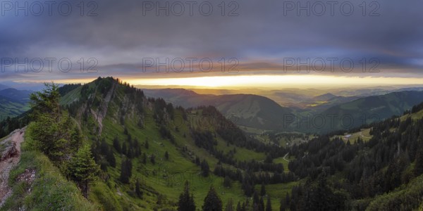 Panoramic view of a light and weather scene over the foothills of the Alps, taken from the