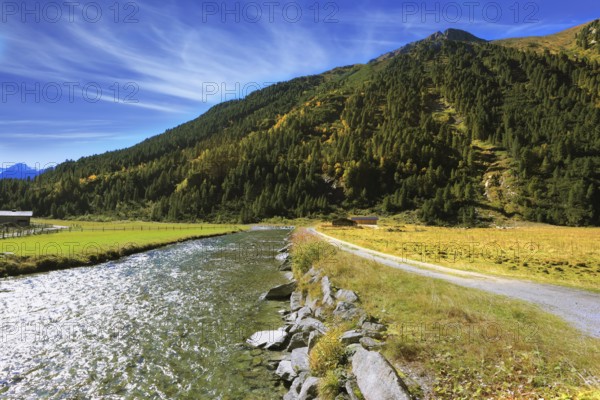 Headwaters of the famous Krimml waterfalls. Crystal clear water glows in the midday sun. Austrian