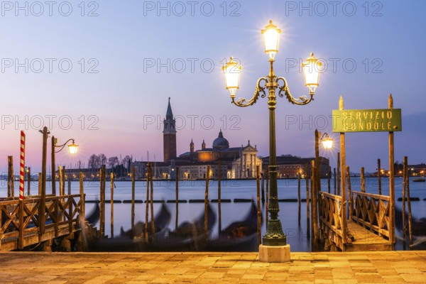 Dawn, Venetian gondolas with the church of San Giorgio Maggiore in the background, Venice, UNESCO