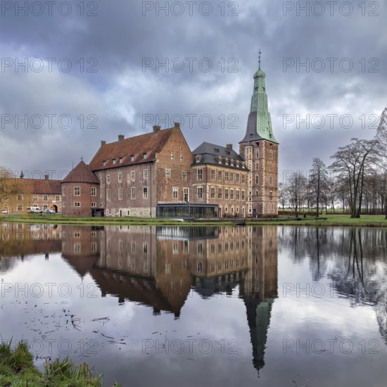 Water castle Raesfeld in Muensterland, North Rhine-Westphalia, Germany. View with reflection in the