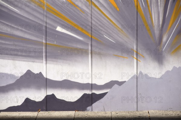 Frankfurt, Germany - August 11, 2018: The drawing of mountains and stylised sunbeams by an unknown