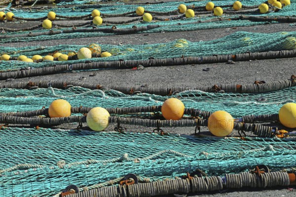 Fishing nets in the port of Loctudy, Finistere, Brittany, France spreading for drying Fishing nets
