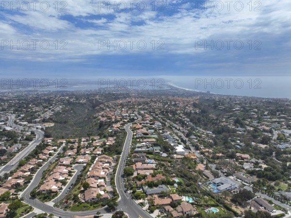 Aerial view over La Jolla Hills with big villas and ocean in the background, San Diego, California,