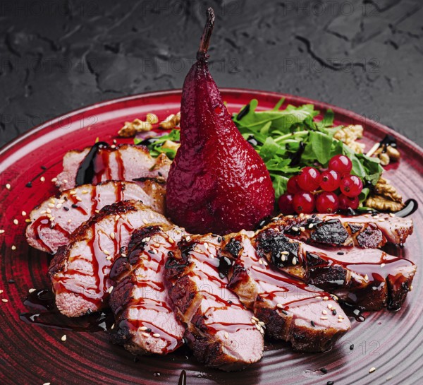 Food, A beautifully plated gourmet dish showcases succulent slices of duck, drizzled with sauce,