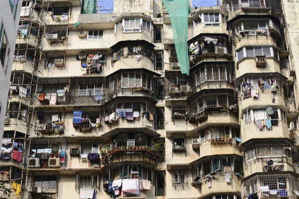 High-rise building with numerous rounded balconies and hanging laundry, Aurangabad, Mumbai, South