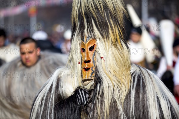 Participants take part in the International Festival of Masquerade Games Surva. The festival