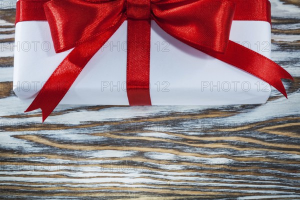 Red gift box on wooden background horizontal view