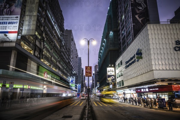 HONG KONG, CHINA - SEPTEMBER 28, 2024: Busy Nathan Rd at night with famous signage, architecture