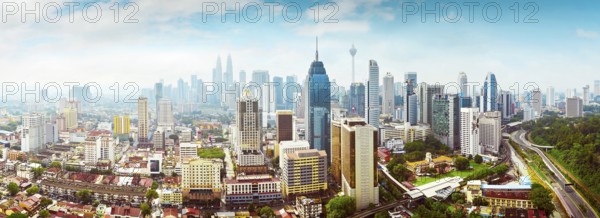 Panorama cityscape view in the middle of Kuala Lumpur city center, early morning with little mist,