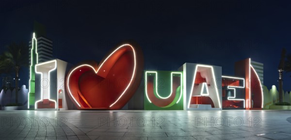 A picture of the I Love UAE sign at night