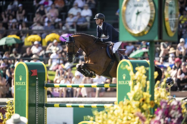 Ben Maher of Great Britain and riding Dallas Vegas Batilly compete in the first round of the 1.60m