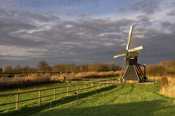The Follega windmill near the Dutch village Laag-Keppel seen under a clouded sky just before the