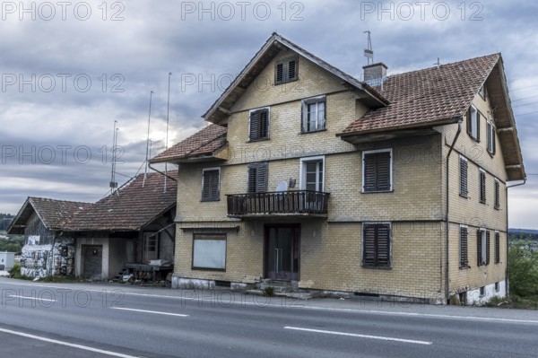 Exterior view with outbuildings of the former Brunner staff house which has since been demolished,