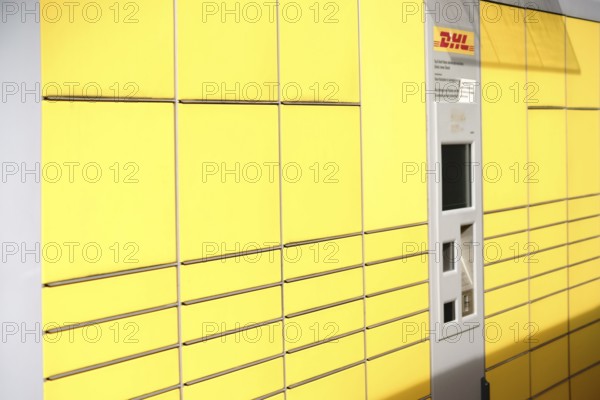 Mainz, Germany - May 27, 2017: Lockers or stacked and lined up parcel boxes with a DHL customer