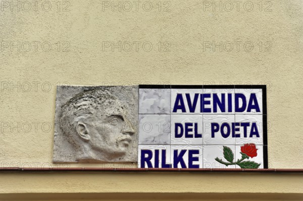 Memorial plaque on a wall with a relief image and Rilke's name, Ronda, Malaga province, Andalusia,